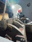 Technician performing maintenance on Liming crusher parts, professional after-sales service
