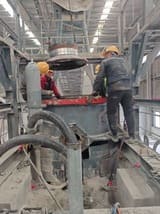 Engineer performing maintenance on SBM crusher equipment, on-site technical support