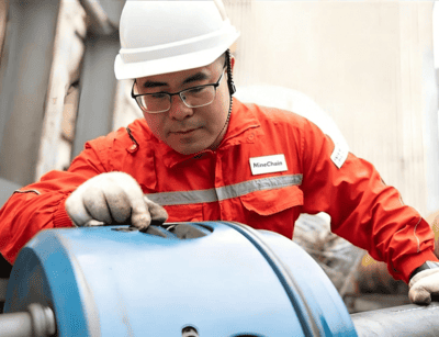 Engineer inspecting crusher spare parts
